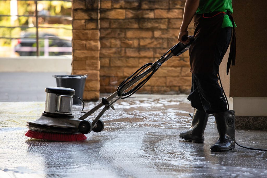 worker cleaning the floor 